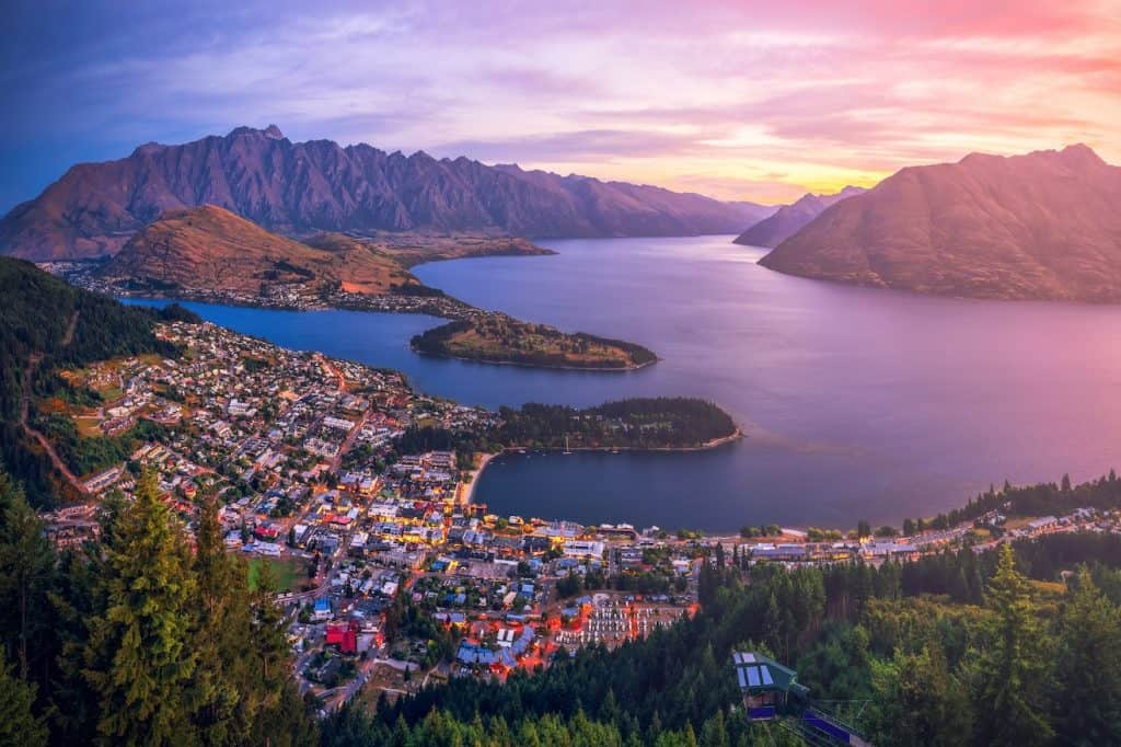Scenic view of Queenstown, Lake Wakatipu, and the Remarkables mountains, a premier travel destination in New Zealand.