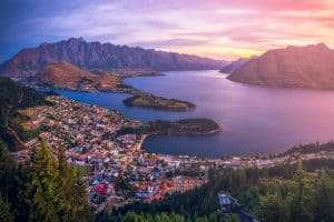 Scenic view of Queenstown, Lake Wakatipu, and the Remarkables mountains, a premier travel destination in New Zealand.
